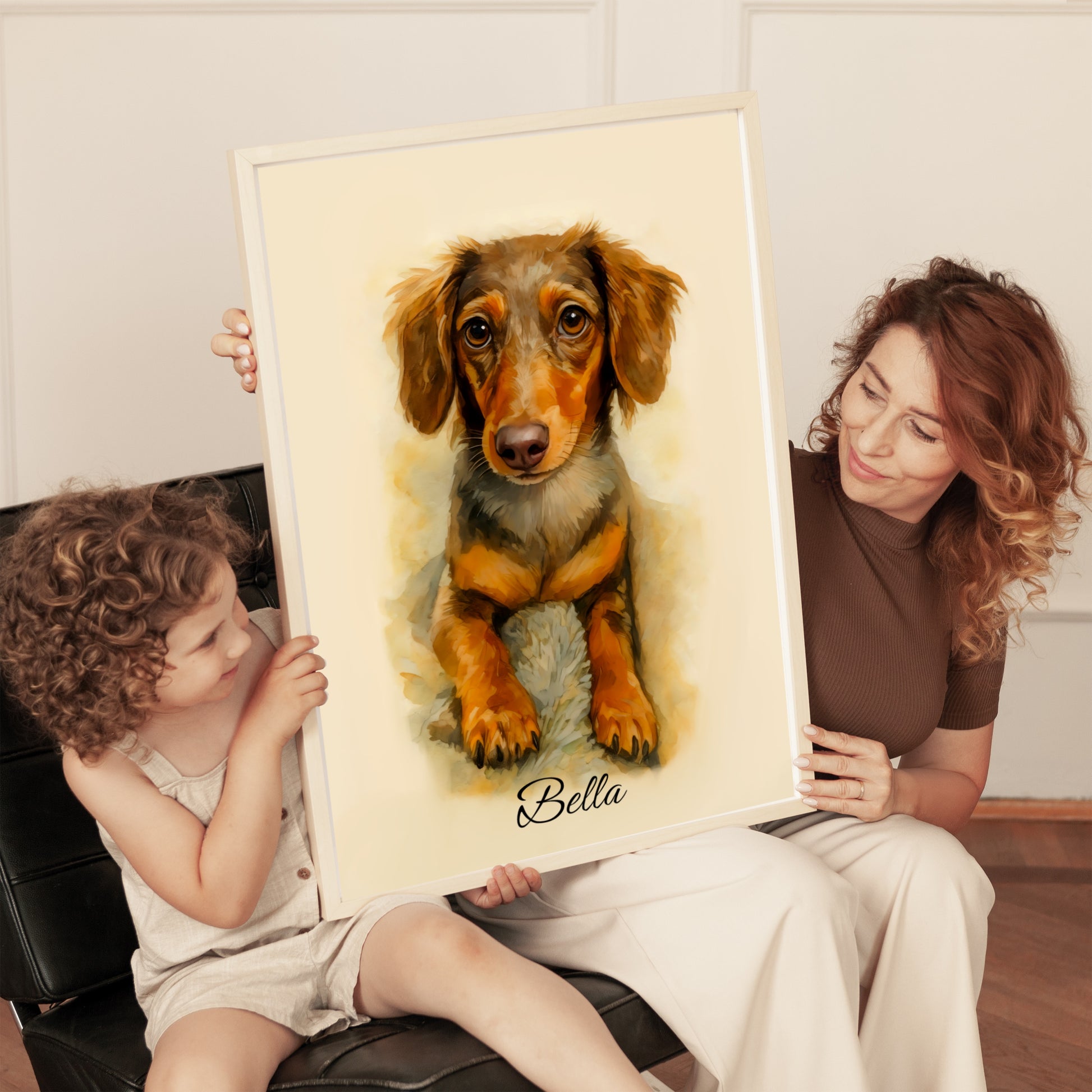Woman and child holding a framed portrait of a dog named Bella.