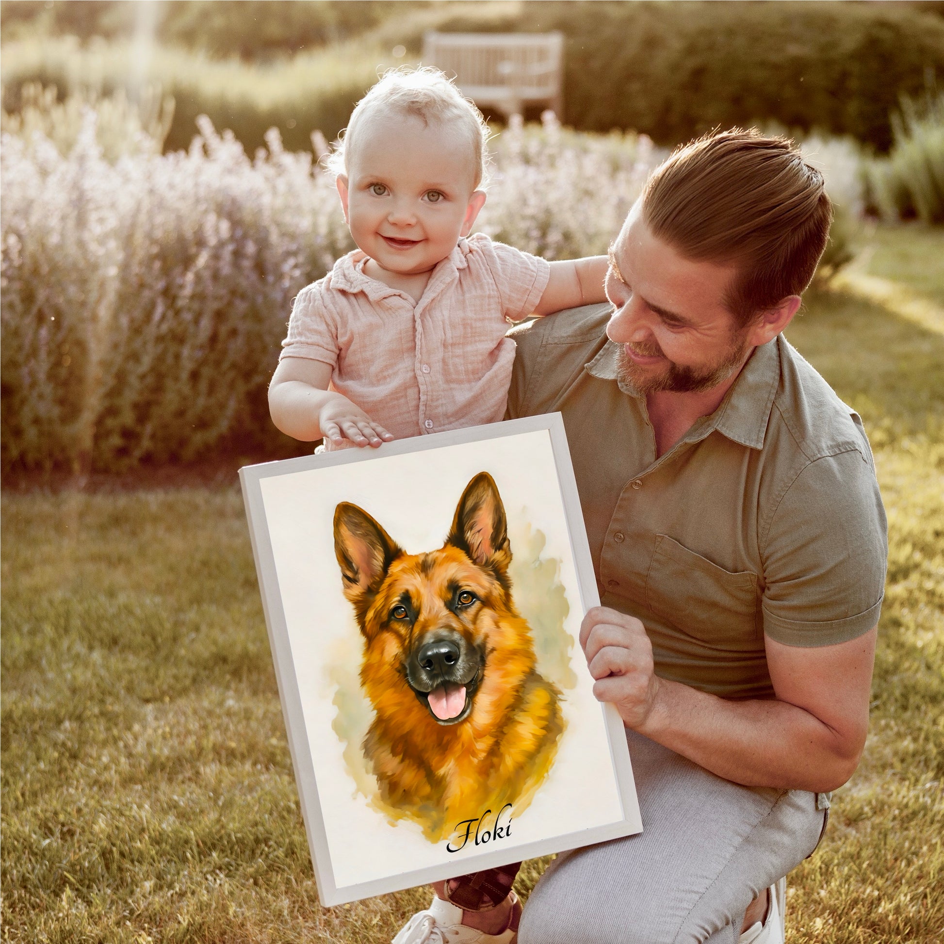Man holding a child and a framed picture of a German Shepherd in a garden setting