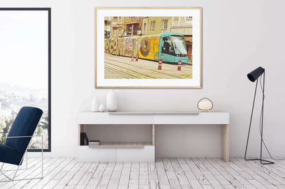 Yellow Tram With Graffiti Artwork by John Brython