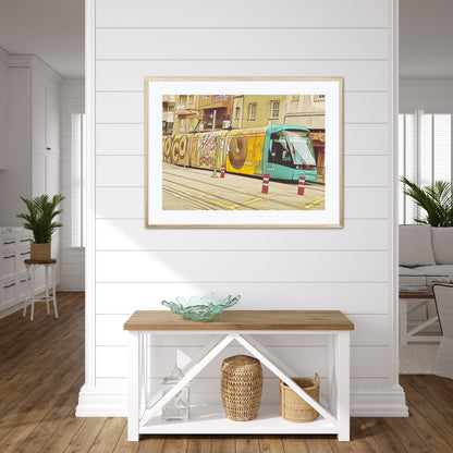 Yellow Tram With Graffiti Artwork by John Brython